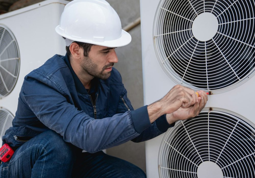 Engineers checking air conditioning cooling system of a major building or industrial facility.